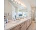 Large bathroom features a separate glass shower and bath plus a large vanity at 4679 El Camino Cabos Dr, Las Vegas, NV 89147