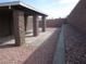 Paver patio and rock landscaping in the backyard, bordered by block wall fencing at 4843 Lana Dr, Las Vegas, NV 89121