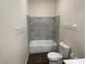 Clean bathroom with tiled shower-tub combination, toilet and towel rack at 4843 Lana Dr, Las Vegas, NV 89121