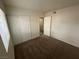 Bright carpeted bedroom featuring a closet and a window at 4843 Lana Dr, Las Vegas, NV 89121