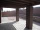 Covered patio with brick pillars and pavers, leading to a low-maintenance rock yard with block wall fencing at 4843 Lana Dr, Las Vegas, NV 89121