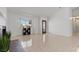 Open living room with tile flooring, a window, and a fireplace at 488 Chelsea Dr, Henderson, NV 89014