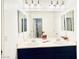 Bright bathroom featuring a double sink vanity, neutral countertops and modern lighting at 4908 Desert Lime Ct, Las Vegas, NV 89148