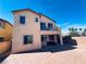 Two-story home with a balcony, covered patio, and a brick-paved patio at 4908 Desert Lime Ct, Las Vegas, NV 89148