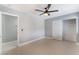 Bright bedroom features a ceiling fan and a large closet at 4986 Palmyra Ave, Las Vegas, NV 89146