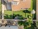 An aerial shot features a home with a meticulously maintained backyard with artificial turf and a play area at 5 Rampart Ct, Henderson, NV 89074