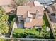 This home has a backyard oasis with artificial turf, a playhouse, and a covered patio at 5 Rampart Ct, Henderson, NV 89074