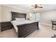 Bedroom featuring a dark wood bed frame and ceiling fan at 5 Rampart Ct, Henderson, NV 89074