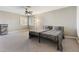 Spacious bedroom with two twin beds, ceiling fan and ample natural light at 5 Rampart Ct, Henderson, NV 89074
