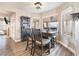 Bright dining area featuring a rustic table, chair set and views of the backyard at 5 Rampart Ct, Henderson, NV 89074