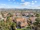 Spacious suburban home with lush landscaping, a tile roof, and a peaceful neighborhood setting near mountains at 5 Rampart Ct, Henderson, NV 89074