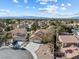 Charming single-Gathering home with a tile roof and a well-manicured front yard featuring mature palm trees at 5 Rampart Ct, Henderson, NV 89074