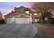 Charming two-story home featuring a three-car garage, landscaped front yard, and a welcoming entrance at 5 Rampart Ct, Henderson, NV 89074