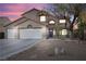 Charming two-story home featuring a three-car garage, landscaped front yard, and a welcoming entrance at 5 Rampart Ct, Henderson, NV 89074