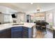 Spacious open kitchen with quartz countertops, stainless steel appliances, and dining area at 5 Rampart Ct, Henderson, NV 89074