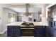 Updated kitchen with stainless steel range and view of the living spaces at 5 Rampart Ct, Henderson, NV 89074