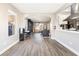 Open living room showcasing modern flooring, recessed lighting, and seamlessly connecting to the kitchen at 5 Rampart Ct, Henderson, NV 89074