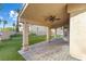 The covered patio showcases a ceiling fan and stylish pavers, creating an inviting outdoor living space at 5 Rampart Ct, Henderson, NV 89074