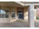 Covered patio offers shade, brick floors, and outdoor space for entertaining at 5 Rampart Ct, Henderson, NV 89074