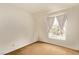 Empty bedroom features neutral carpet, a window with curtains, and electrical outlets at 5033 Chambliss Dr, Las Vegas, NV 89130