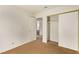 An empty bedroom features neutral carpet, a closet with sliding doors, and a bathroom doorway at 5033 Chambliss Dr, Las Vegas, NV 89130