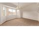 Dining area with large bay windows providing lots of natural light and plush carpeting at 5033 Chambliss Dr, Las Vegas, NV 89130