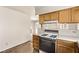 Traditional kitchen with wood cabinets and view of dining area and backyard at 5033 Chambliss Dr, Las Vegas, NV 89130