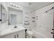 Bathroom features a vanity with mirror and a shower-tub combination at 5044 Whistling Acres Ave, Las Vegas, NV 89131