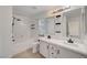 Bathroom features a shower and tub, double sinks, tiled flooring, and recessed lighting at 5044 Whistling Acres Ave, Las Vegas, NV 89131