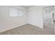 A carpeted bedroom with closet and window at 5044 Whistling Acres Ave, Las Vegas, NV 89131