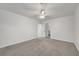 Spacious bedroom featuring neutral carpet and access to the bathroom at 5044 Whistling Acres Ave, Las Vegas, NV 89131
