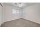 Bedroom featuring neutral carpet, a window, and a ceiling fan with light fixture at 5044 Whistling Acres Ave, Las Vegas, NV 89131