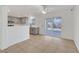 Open dining area with tile flooring, view of kitchen and sliding glass doors to the backyard at 5044 Whistling Acres Ave, Las Vegas, NV 89131