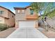 Charming two-story home with a two-car garage and well-maintained landscaping at 5044 Whistling Acres Ave, Las Vegas, NV 89131