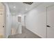 Upstairs hallway features neutral carpet, white walls, baseboards and doors, and recessed lighting at 5044 Whistling Acres Ave, Las Vegas, NV 89131