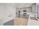 Well-lit kitchen featuring stainless steel appliances and sleek, modern countertops at 5044 Whistling Acres Ave, Las Vegas, NV 89131