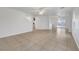 Spacious living room featuring tile flooring, ceiling fans and lots of natural light at 5044 Whistling Acres Ave, Las Vegas, NV 89131