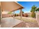 Covered patio overlooks a landscaped backyard at 5044 Whistling Acres Ave, Las Vegas, NV 89131