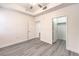 Bright bedroom features a modern ceiling fan and laminate floors and access to an ample closet at 51 E Agate Ave # 205, Las Vegas, NV 89123
