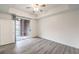 Bright bedroom with a sliding glass door and neutral walls with hardwood flooring at 51 E Agate Ave # 205, Las Vegas, NV 89123