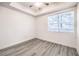 Bright bedroom features a modern ceiling fan, and a large window that provides natural light at 51 E Agate Ave # 205, Las Vegas, NV 89123