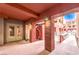 Entrance way with exposed rafters, beams, cement flooring and walls and door leading to elevator at 51 E Agate Ave # 205, Las Vegas, NV 89123