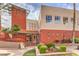 A well-maintained building exterior with manicured landscaping, leading to the entrance of the building at 51 E Agate Ave # 205, Las Vegas, NV 89123