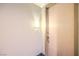 Hallway features unit number 205, light fixture, a door and dark granite flooring at 51 E Agate Ave # 205, Las Vegas, NV 89123