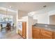 Kitchen featuring an open layout with granite countertops, cabinets, and dining area at 51 E Agate Ave # 205, Las Vegas, NV 89123