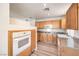 Open kitchen features granite countertops, stainless steel appliances, and hardwood floors at 51 E Agate Ave # 205, Las Vegas, NV 89123