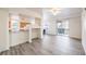 Open-concept living room seamlessly connects to the kitchen and features a slider to a balcony at 51 E Agate Ave # 205, Las Vegas, NV 89123