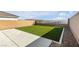 Low maintenance backyard with artificial turf, concrete, and gravel landscaping at 5398 Pico Viejo St, Las Vegas, NV 89166