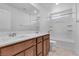 Bathroom with double sinks and a bathtub shower combo at 5398 Pico Viejo St, Las Vegas, NV 89166