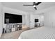 Bright bedroom with a ceiling fan, TV, and soft carpet flooring at 5398 Pico Viejo St, Las Vegas, NV 89166